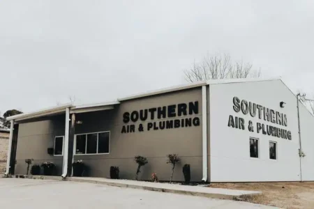 Southern Air & Plumbing commercial building exterior with tan and white facade and signage.