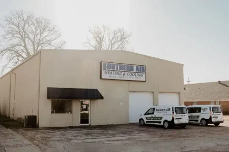 Southern Air Heating & Cooling commercial building with service vehicles parked outside in Monroe, Louisiana.